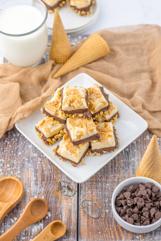 No-Bake Drumstick Ice Cream Fudge recipe inspired by the flavors of classic Drumstick ice cream cones. This is amazing, tasting just like the cones you ate as a child. Creamy fudge with crushed sugar cones on top, then dipped into a yummy chocolate and salted peanuts. Such a great, tasty and easy fudge to make!