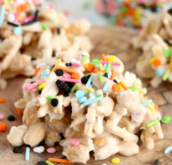 Get ready for Halloween with this fun, festive, and easy White Chocolate Halloween Crock Pot Candy made with crunchy chow mein noodles, creamy white chocolate bark, and colorful Halloween sprinkles. These no-bake Halloween treats are the perfect last-minute party snack or spooky holiday dessert made right in the slow cooker that kids and adults will love.