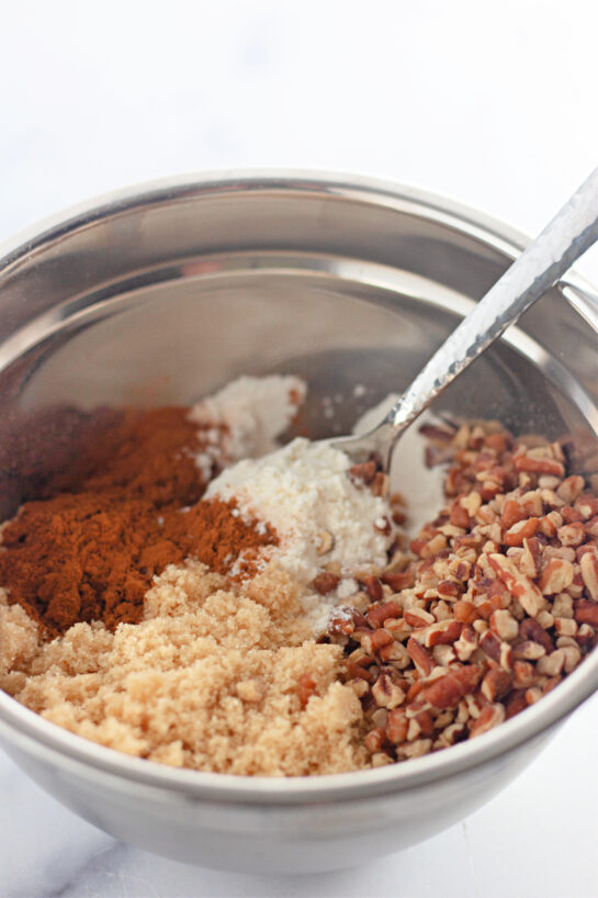 Mixing the dry ingredients needed to make the Honey Bun Cake recipe for the holidays