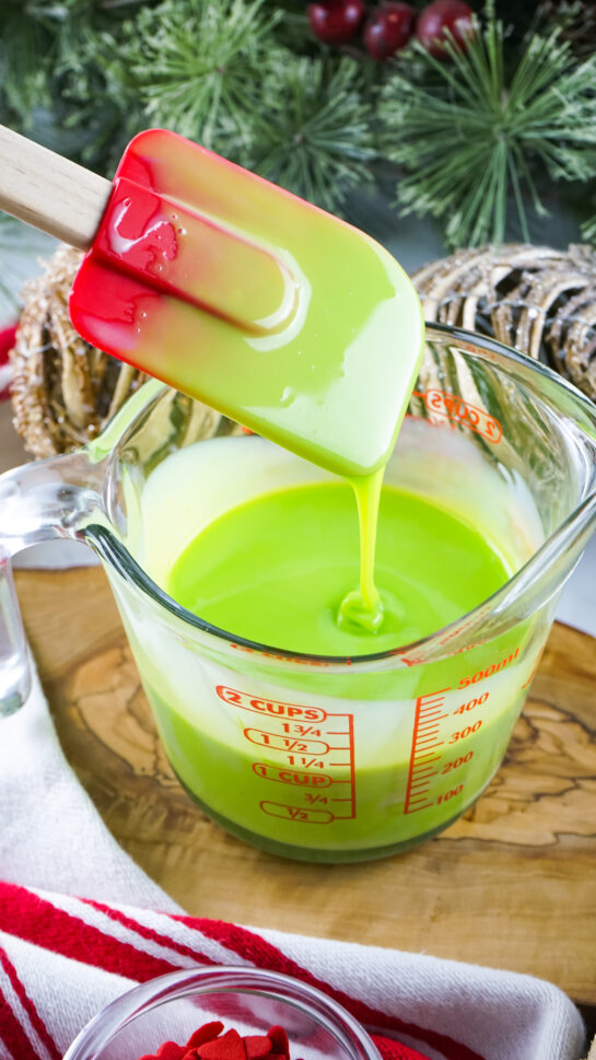 Green food coloring ready to be made into Grinch Fudge recipe