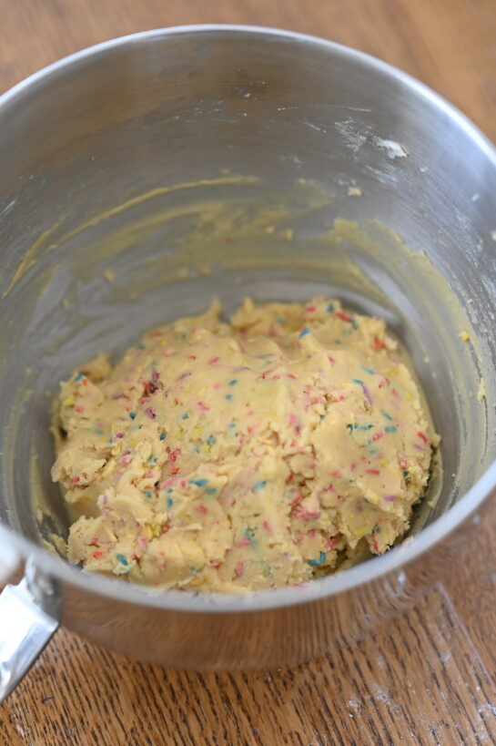 Mixing the ingredients in a bowl for the Soft Sprinkle Sugar Cookies recipe
