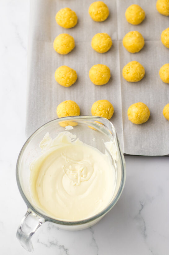 Ready to dip the cake balls in the melted white chocolate to make the bunny butt lemon truffles recipe for Easter.