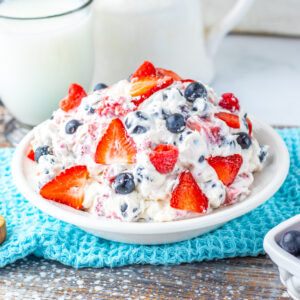 Berry Cheesecake Salad recipe made easy: creamy brick-style cream cheese, powdered sugar, heavy cream, vanilla, Cool Whip, and fresh strawberries, raspberries, and blueberries. A no-bake, 10-minute dessert recipe that’s light, fluffy, and crowd-pleasing—perfect for potlucks, BBQs, and holidays. Make-ahead friendly and bursting with triple-berry flavor.