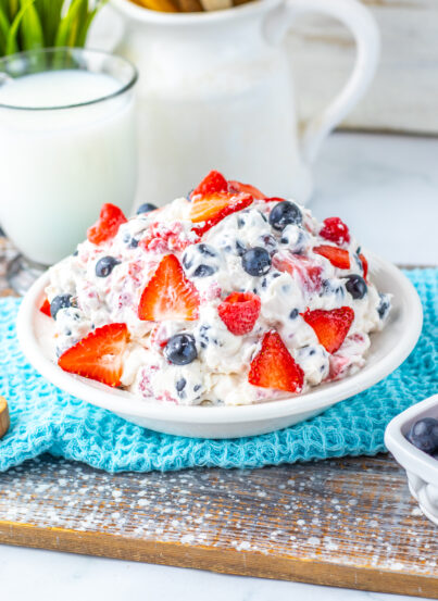 Berry Cheesecake Salad recipe made easy: creamy brick-style cream cheese, powdered sugar, heavy cream, vanilla, Cool Whip, and fresh strawberries, raspberries, and blueberries. A no-bake, 10-minute dessert recipe that’s light, fluffy, and crowd-pleasing—perfect for potlucks, BBQs, and holidays. Make-ahead friendly and bursting with triple-berry flavor.